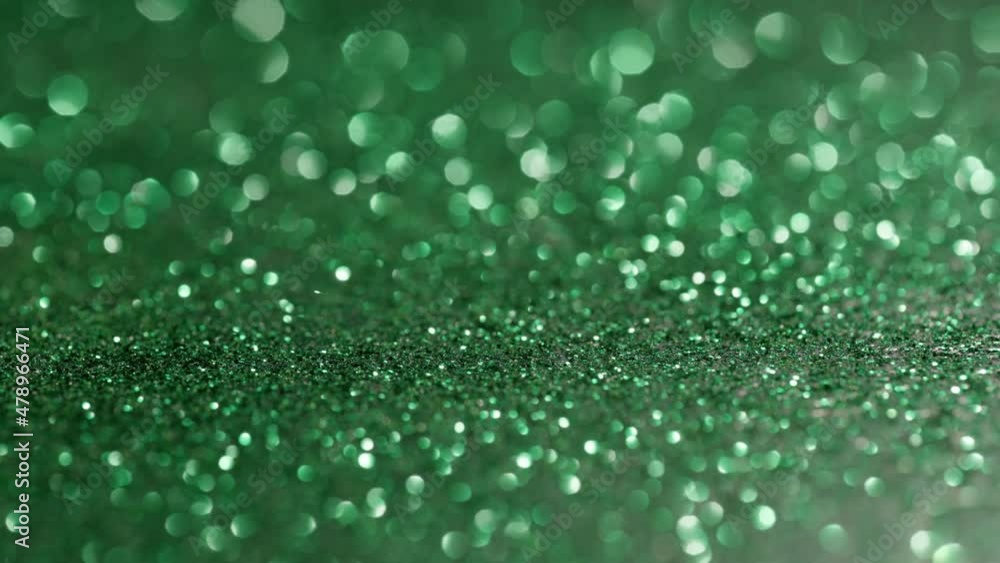 Abstract video background with green color. Particles of green glitter in soft focus fly. Abstract video background with green color. Particles of green glitter in soft focus fly.
