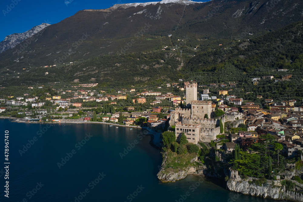 Panoramic aerial view of the Scaliger Castle in Malcesine in Malcesine. Malcesine town, Lake Garda, Italy. Italian resort on Lake Garda, Monte Baldo.