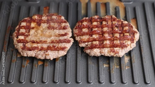 The cutlets are grilled. Ground beef cutlets are grilled close-up.
