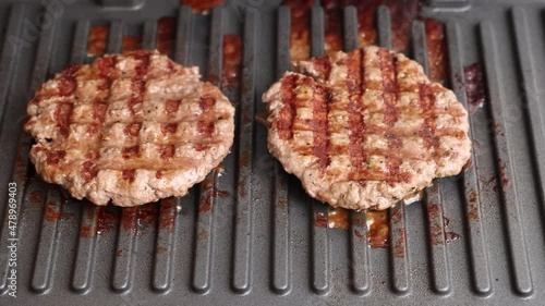 The cutlets are grilled. Ground beef cutlets are grilled close-up.
