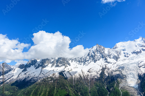 The Mont Blanc Massif and its eternal snows in the Mont Blanc Massif in Europe, France, the Alps, towards Chamonix, in summer, on a sunny day.