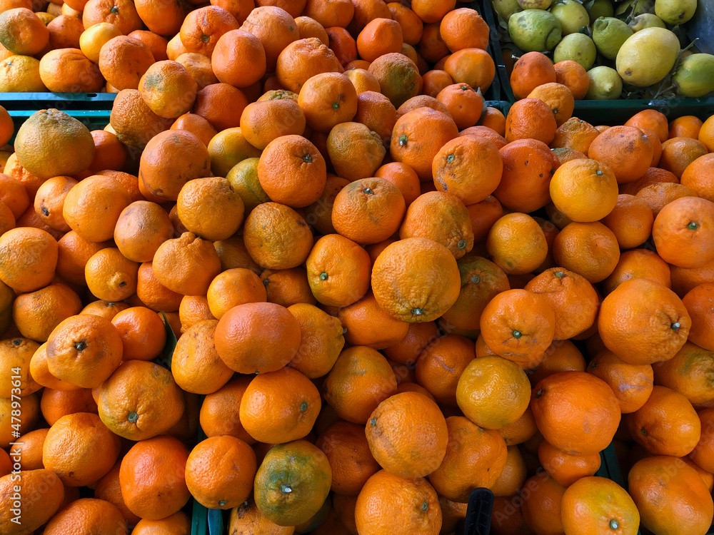 Piles of fresh oranges