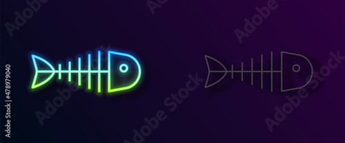 Glowing neon line Fish skeleton icon isolated on black background. Fish bone sign. Vector