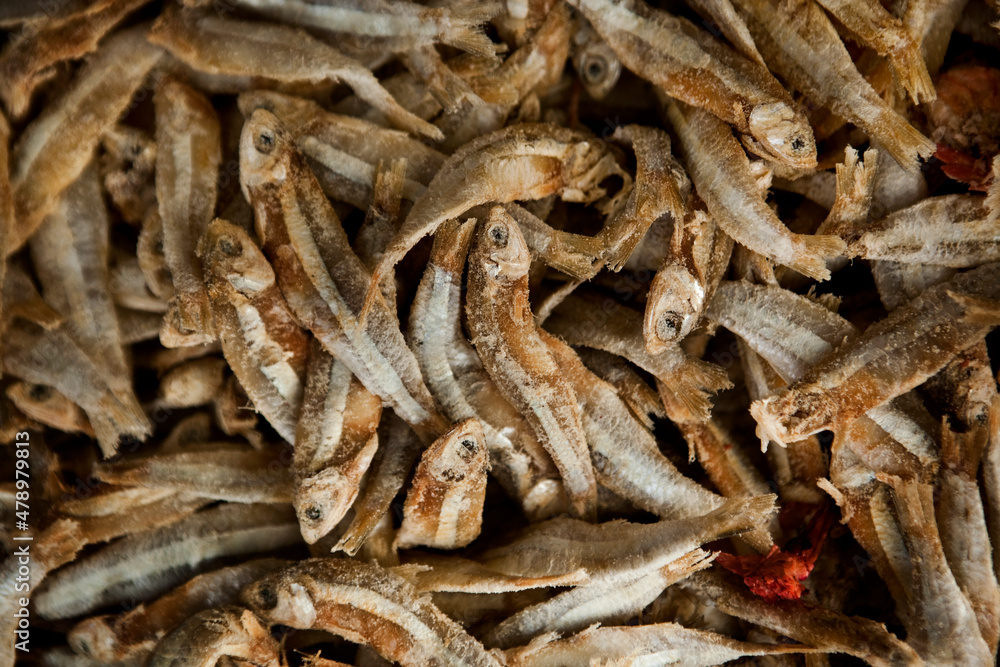 sardine fish sprats smoked or salted seafood mackerel at a street food market stand. food background rustic