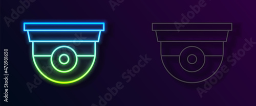 Glowing neon line Security camera icon isolated on black background. Vector