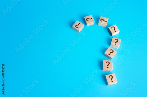 Large question mark made of blocks with question marks. Curiosity and exploration. Search an answer by facts. Analysis and generalization. Cooperation of forces for resolution. Induction and deduction photo