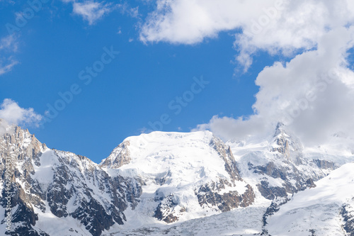 Mont Blanc du Tacul hidden by clouds in the Mont Blanc Massif in Europe  France  the Alps  towards Chamonix  in summer  on a sunny day.