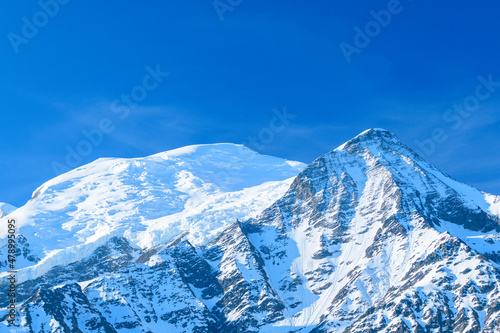 Mont Blanc and the Aiguille du Gouter in Europe, France, the Alps, towards Chamonix, in summer, on a sunny day. © Florent