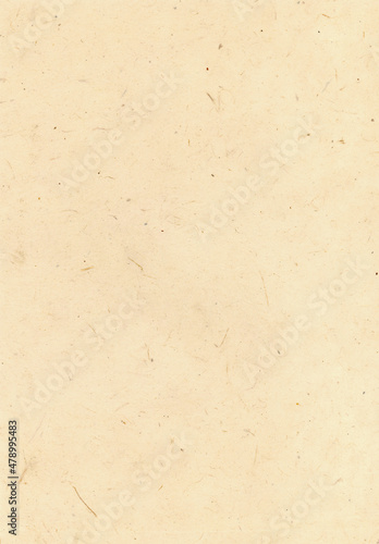 Handmade paper with visible natural fibers. Meant as background. 