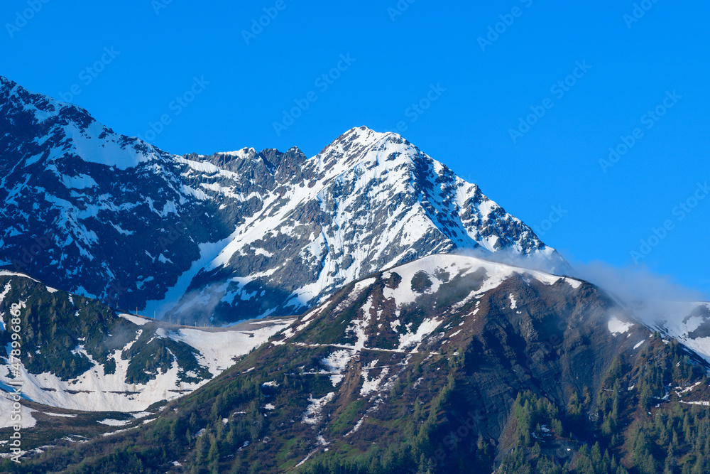 The close-up on the snow-capped Mont Lachat in the Mont Blanc Massif in Europe, France, the Alps, towards Chamonix, in summer, on a sunny day.