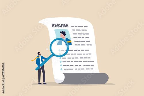 Candidate resume review by HR human resources hiring manager, employment or searching for talent and new staff concept, smart businessman hiring manager using magnifying glass tor review resume.