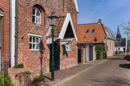 Street with old buildings in the center of Nieuweschans, Netherlands