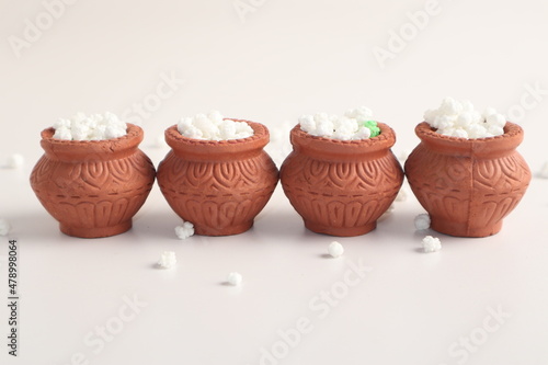 Indian festival makar sankranti concept : Tilgul in small bowl. Tilgul is a colourful sesame candy coated with sesame seeds  in Maharashtra people exchange tilgul on Sankranti © Bilal