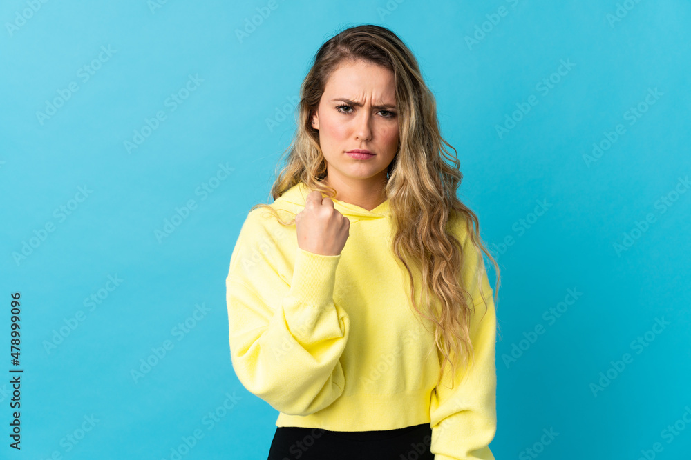 Fototapeta premium Young Brazilian woman isolated on blue background with unhappy expression