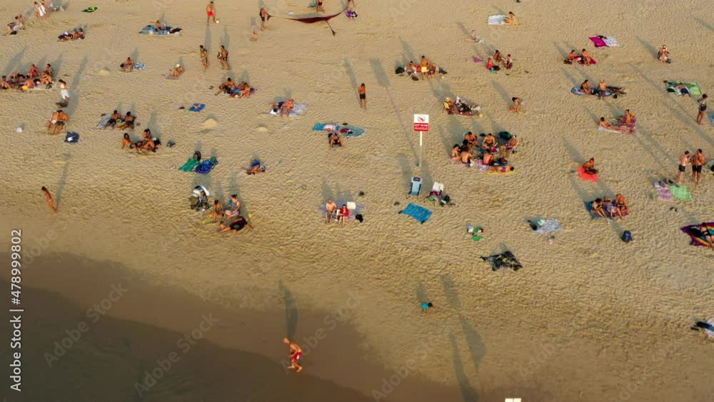 Aerial Backward Tourists At Beach During Vacation, Drone Ascending Over Sea - Tel Aviv, Israel Aerial Backward Tourists At Beach During Vacation, Drone Ascending Over Sea - Tel Aviv, Israel