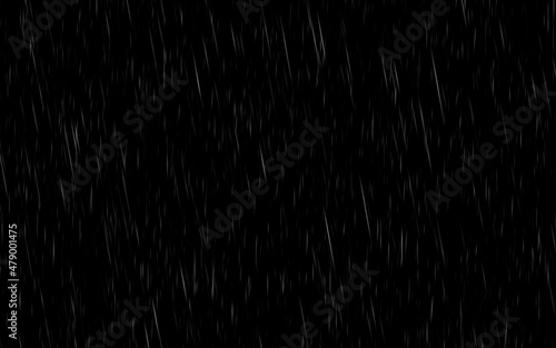 Night rain. Falling drops of rain on a dark background.