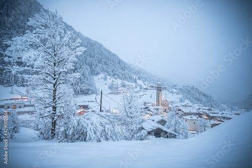 Alpine village in a white winter landscape after snowfall, Gerola Alta, Valgerola, Valtellina, Lombardy, Italy