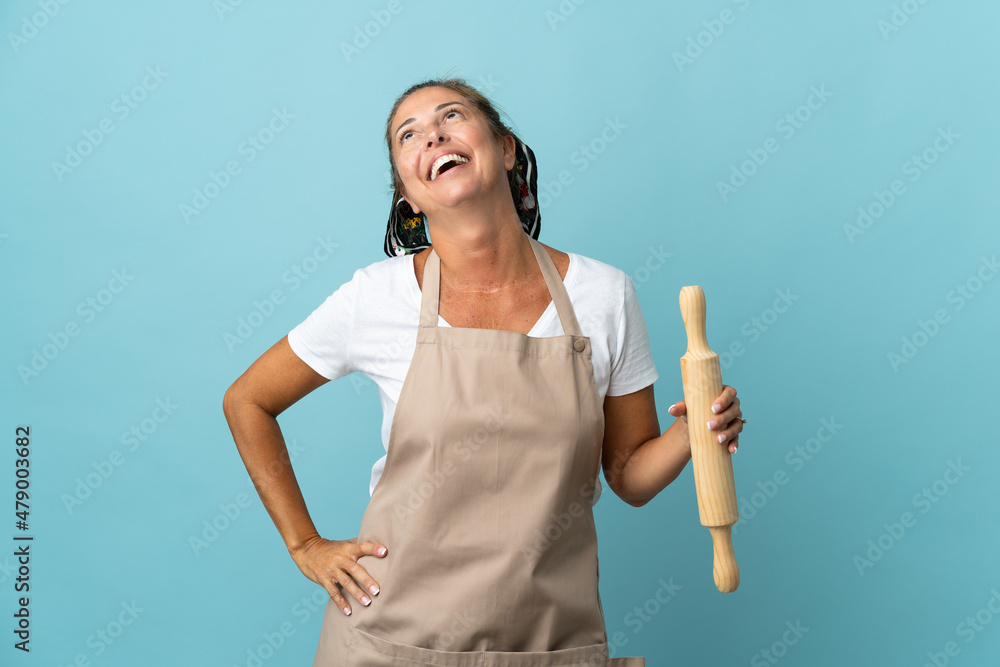 Middle age woman in chef uniform laughing Middle age woman in chef uniform laughing
