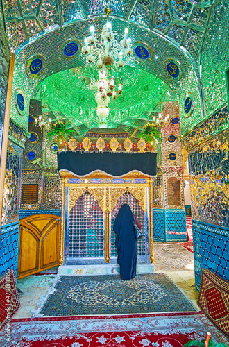 Praying Shia muslim woman Shahzadeh-ye Ibrahim Holy Shrine, Kashan, Iran photo