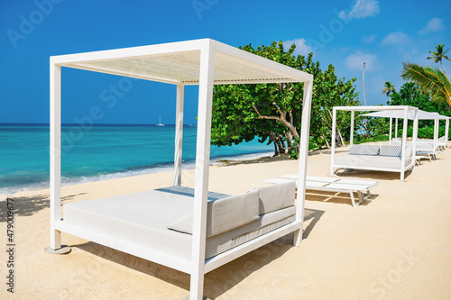 white bed on the sandy beach of the sea