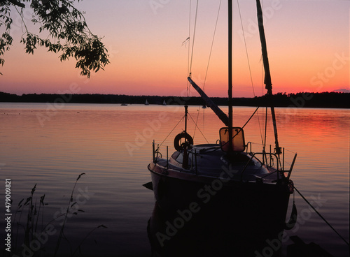 Fototapeta Naklejka Na Ścianę i Meble -  Beldany Lake, sail boat in Piaski marina, Masuria region, Poland