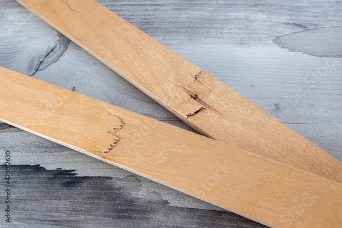 Fotografie Broken lamella wooden plank bed furniture repair part element detail