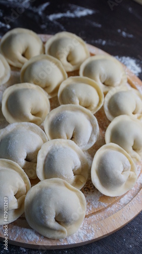 dumplings, a traditional dish of Russian cuisine, made of dough stuffed with minced meat, minced meat, cooking process, modeling, recipe