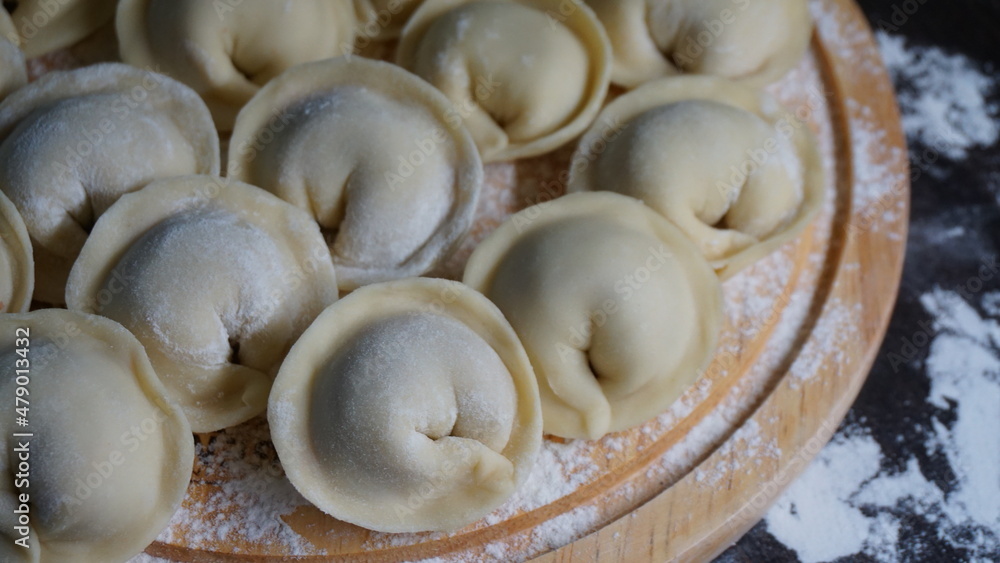 dumplings, a traditional dish of Russian cuisine, made of dough stuffed with minced meat, minced meat, cooking process, modeling, recipe dumplings, a traditional dish of Russian cuisine, made of dough stuffed with minced meat, minced meat, cooking process, modeling, recipe