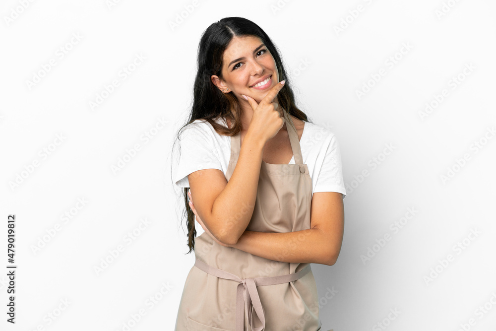 Restaurant waiter over isolated white background smiling Restaurant waiter over isolated white background smiling