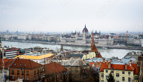 Hungarian Parliament Building - Image contains old European housing in the foreground.