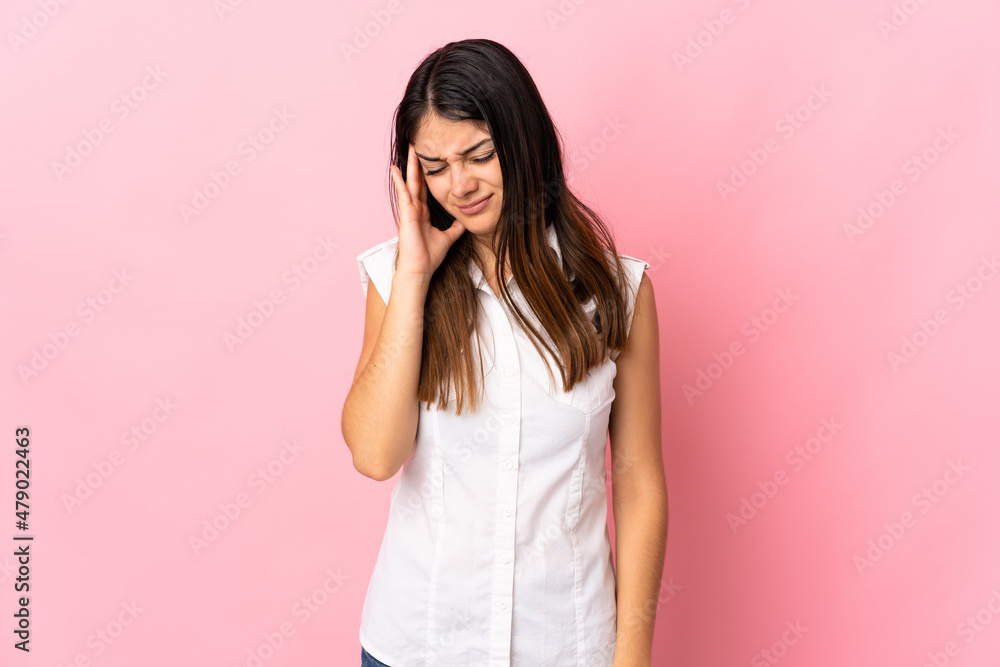 Young caucasian woman isolated on pink background with headache Young caucasian woman isolated on pink background with headache