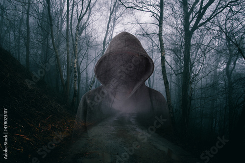Bilde på lerret A horror concept of a double exposure of a scary hooded figure with no face