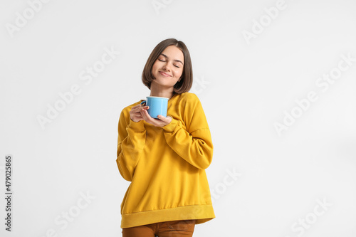 Beautiful woman with cup of...