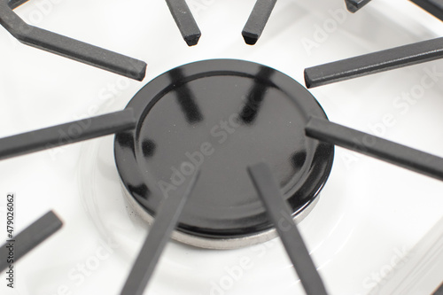 Close-up shoy of a rapid gas burner of a white gas hob photo