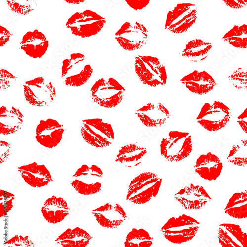Vector seamless pattern of red kissing lips stamps randomly scattered on white background.