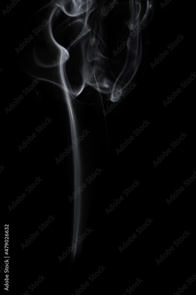wax candle with burning wick and smoke, isolated on a black background wax candle with burning wick and smoke, isolated on a black background