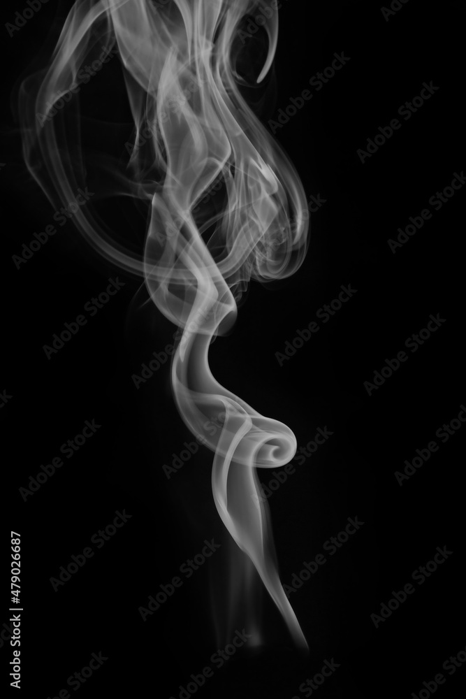 wax candle with burning wick and smoke, isolated on a black background wax candle with burning wick and smoke, isolated on a black background
