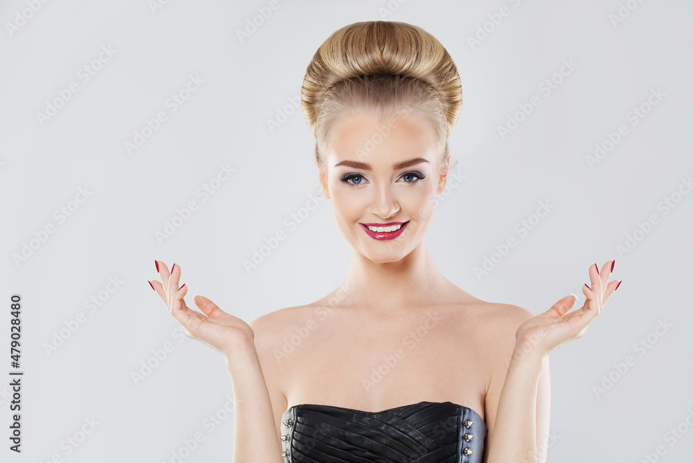 Fototapeta premium Happy smiling woman showing empty open hands on white