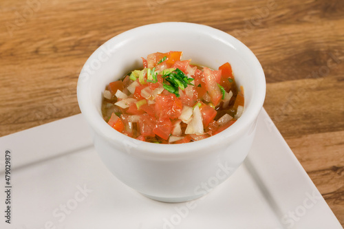 Fotografija .Vinagrete or Vinaigrette is. a traditional Brazilian sauce made with tomato, pe
