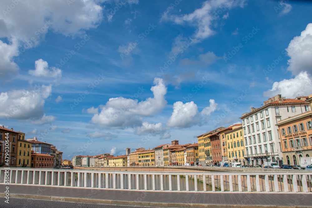 Pisa, Italy, September 2015, bridge over the Arno river, embankment with colorful houses