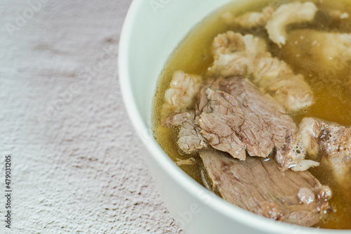 Galbitang, Korean style beef Short Rib Soup : Beef ribs, soaked in cold water to remove the blood, and white radish chunks simmered together until tender. The clear stock is rich and savory, and the t photo