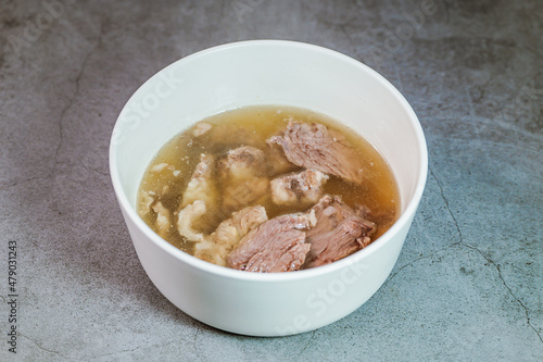 Galbitang, Korean style beef Short Rib Soup : Beef ribs, soaked in cold water to remove the blood, and white radish chunks simmered together until tender. The clear stock is rich and savory, and the t photo