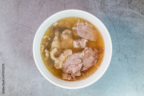 Galbitang, Korean style beef Short Rib Soup : Beef ribs, soaked in cold water to remove the blood, and white radish chunks simmered together until tender. The clear stock is rich and savory, and the t photo