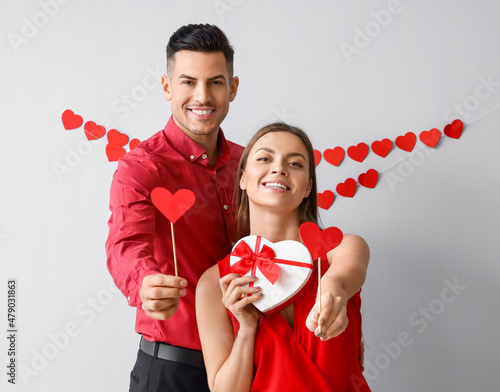 Happy young couple with gif...
