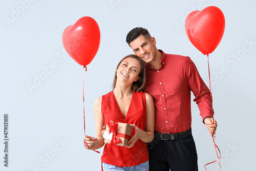 Happy young couple with gif...