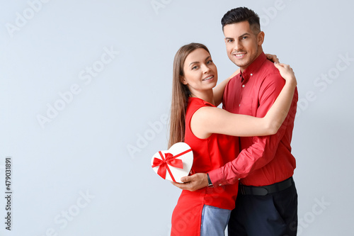 Happy young couple with gif...