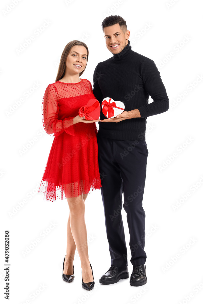 Happy young couple with gifts on white background. Valentine's Day celebration Happy young couple with gifts on white background. Valentine's Day celebration