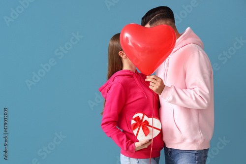 Happy young couple with gif...