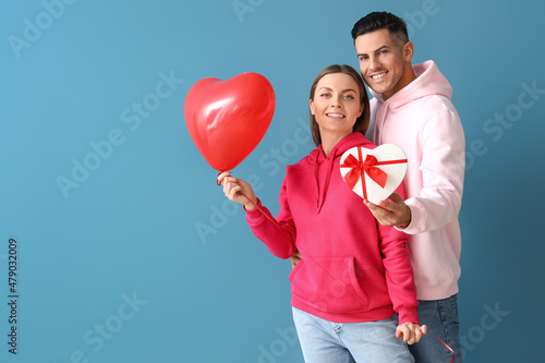 Happy young couple with gif...