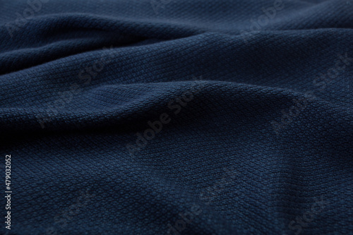 Close up of texture of hand woven shawl, Thai cotton indigo dyed